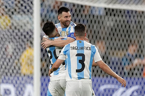 Lionel Messi is congratulated after scoring Argentina's second goal